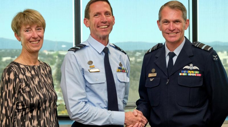 Chief of Air Force Air Marshal Robert Chipman, right, congratulates Air Vice Marshal Steve Edgeley on receiving his Doctor of Philosophy (PhD). Also in attendance was Air Vice Marshal Edgeley's wife, Pippa Edgeley. Story by John Noble. Photo by Flight Sergeant Kev Berriman.