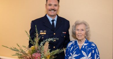 Jessie Strike-McClelland and Flight Lieutenant Justin Kelly with her 100th Birthday gift from the Australian Embassy at San Clemente Villas by the Sea, California. Story by Leading Aircraftwoman Cath Kelly.