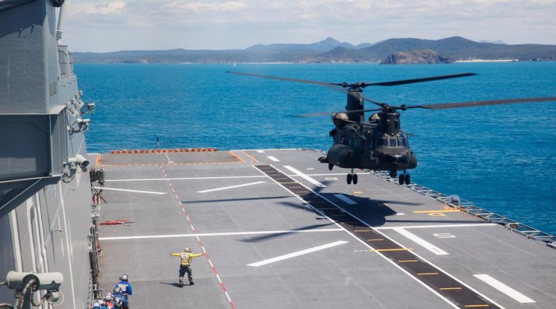 A Republic of Singapore Air Force CH-47F helicopter lands on the flight deck of HMAS Adelaide during Exercise Trident near Shoalwater Bay training area, Queensland. Story by Captain Carla Armenti. Photo by Corporal Cameron Pegg.