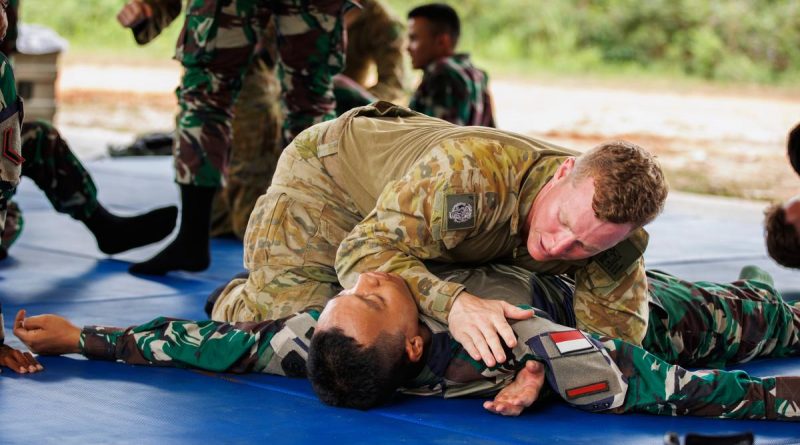Australian Army Private Christian Scott from 5th Battalion, Royal Australian Regiment, practices Pencak Silat with Indonesian Army soldiers during Exercise Wirra Jaya at the Baturaja Training Area, South Sumatra, Indonesia. Story and photo by Corporal Dustin Anderson.