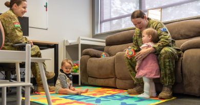 Captain Stephanie Costa, left, and Corporal Britney Pascoe with their bubs in the parents room. Story by Captain Andrew Page. Photo by Major Paul Krohn.