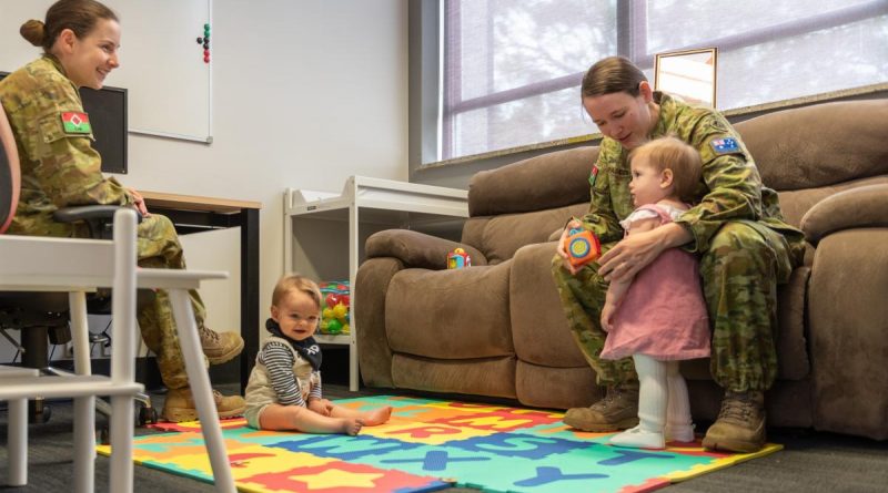 Captain Stephanie Costa, left, and Corporal Britney Pascoe with their bubs in the parents room. Story by Captain Andrew Page. Photo by Major Paul Krohn.