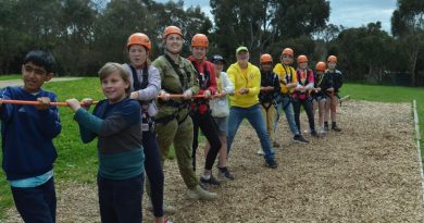 Lieutenant Amber Duncan from the 3rd Health Battalion jumps in to help with the giant swing during the unit's community engagement day with Camp Quality in Camp Mylor, South Australia. Story by Captain Annie Richardson.
