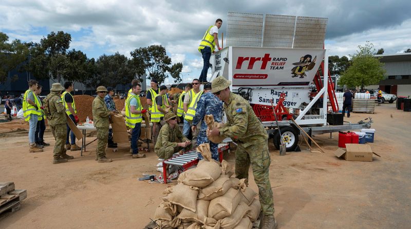 Australian Defence Force personnel assist Shepparton residents affected by the floods in the Victoria region. Photo by Private Tyson Grant.