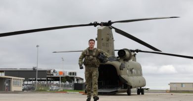 Corporal Darcy Enshaw, of 5th Aviation Regiment, on the flightline with a Chinook at Essendon Airport, Victoria. Story and photo by Captain Carolyn Barnett.