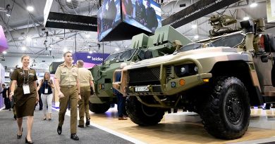 Chief of Army Lieutenant General Simon Stuart tours the convention floor at Land Forces 2022 in Brisbane. Photo by Sergeant Tristan Kennedy.