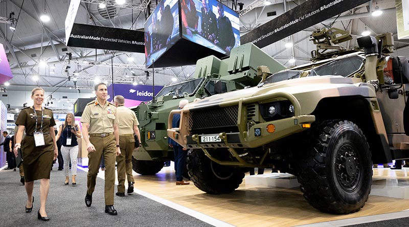 Chief of Army Lieutenant General Simon Stuart tours the convention floor at Land Forces 2022 in Brisbane. Photo by Sergeant Tristan Kennedy.