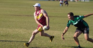 ACT/NSW Country’s Squadron Leader Danny Bretherton, left, works hard to evade the desperate defence of North Queensland’s Corporal Andrew Cooper. Story by Squadron Leader Peter Croce. Photo Supplied.