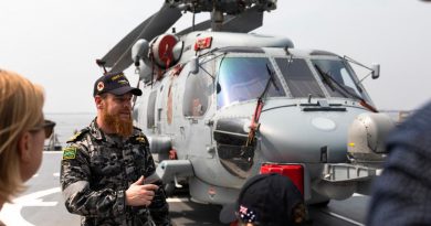 Flight Commander Lieutenant Commander Thomas Craig talks with guests from the Australian Embassy in Manila, Philippines, during a tour of HMAS Hobart while berthed in Manila Bay. Story by Captain Zoe Griffyn. Photo by Leading Seaman Daniel Goodman.