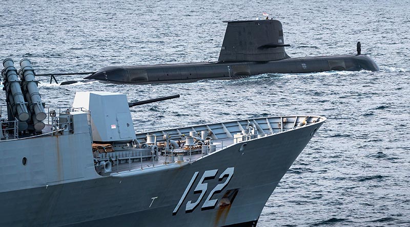 Royal Australian Navy submarine HMAS Waller sails in company with HMAS Warramunga during the inaugural Australian Submarine Command Course off Australia's east coast. Photo by Able Seaman Jarryd Capper.