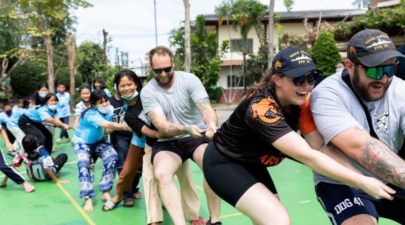HMAS Arunta sailors take on the children from the Father Ray Foundation in Sattahip, Thailand, in a tug of war. Story by Lieutenant Chayce Pullen. Photo by Leading Seaman Susan Mossop.
