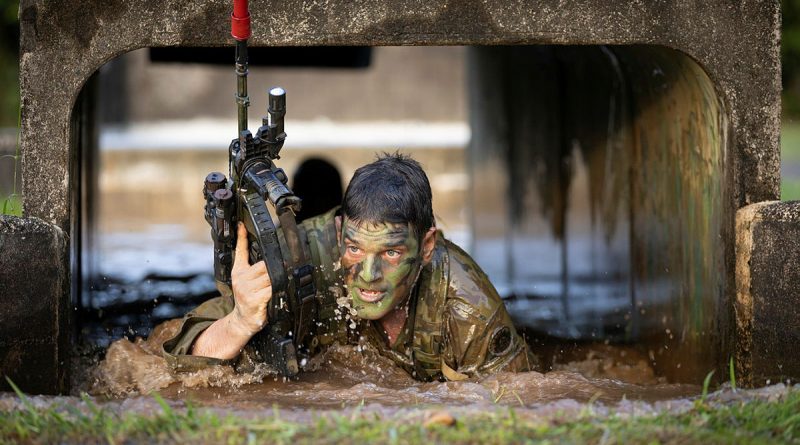 Australian Army officer, Officer Commanding Alpha Company, Major Jared Slansky of 8th/9th Battalion, The Royal Australian Regiment emerges from the bear pit tunnel during Exercise True Grit at Tully Training Area, Queensland. Story by Captain Taylor Lynch. Photo by Sergeant Matthew Bickerton.