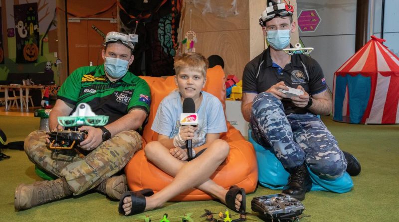 Army Sapper Alex Brown and Air Force Flight Lieutenant Jake Dell-O'Sullivan with 11-year-old Marlin Mott at Queensland Children's Hospital. Story by Captain Sarah Vesey. Photo by Leading Aircraftwoman Kate Czerny.