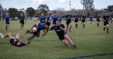 Sapper Jack Arrowsmith carries the ball in attack with Corporal Joshua Allen and Lance Corporal Siaka King in support, during ADF v NZDF rugby union test, Brisbane. Story by Lieutenant Kirsti Welling-Burtenshaw. Photo by Corporal Miguel Anonuevo.