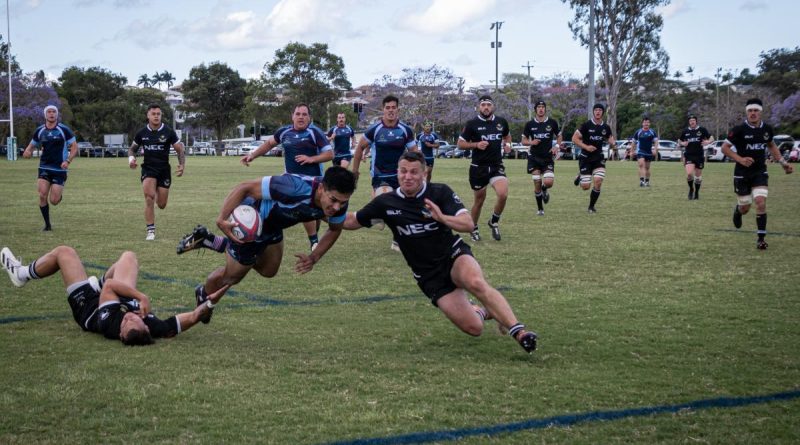 Sapper Jack Arrowsmith carries the ball in attack with Corporal Joshua Allen and Lance Corporal Siaka King in support, during ADF v NZDF rugby union test, Brisbane. Story by Lieutenant Kirsti Welling-Burtenshaw. Photo by Corporal Miguel Anonuevo.