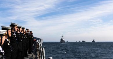 HMAS Hobart prepares to sail past the reviewing ship, Japan Maritime Self-Defense Force helicopter carrier JS Izumo, during the International Fleet Review 2022 off the coast of Yokosuka, Japan. Story by Lieutenant Brendan Trembath. Photo by Leading Seaman Daniel Goodman.