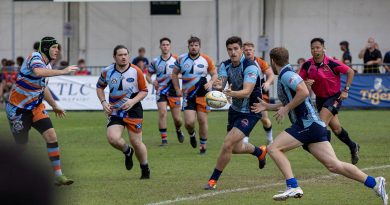 Craftsman Mathew Kelly, passes the ball during the 73rd Singapore Cricket Club International Rugby Sevens Tournament. Story by Lieutenant Amy Johnson. Photo by Leading Seaman Nadav Harel.