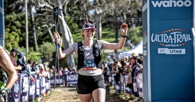 Captain Meghann Coffey, a physio from the 1st Health Battalion, crosses the finish line during an ultra-trail marathon in Katoomba. Story by Private Nicholas Marquis.