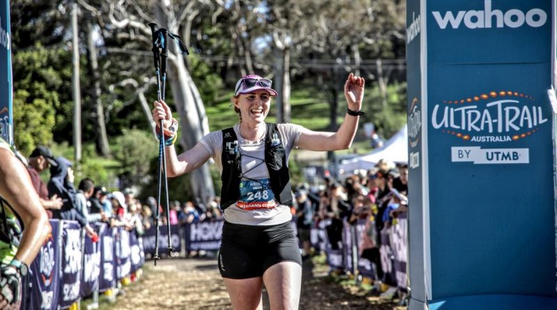 Captain Meghann Coffey, a physio from the 1st Health Battalion, crosses the finish line during an ultra-trail marathon in Katoomba. Story by Private Nicholas Marquis.