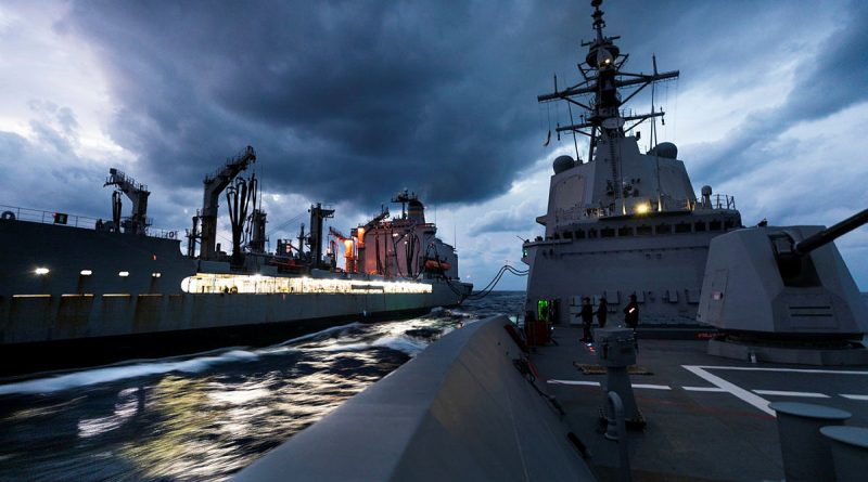 USNS Rappahannock, left, conducts a replenishment at sea with HMAS Hobart during Exercise Keen Sword. Story by Lieutenant Brendan Trembath. Photo by Leading Seaman Daniel Goodman.