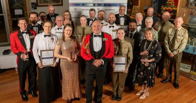 Major General Douglas Laidlaw poses with winners of Defence’s annual National Employer Support Awards at a formal dinner held at Gallipoli Barracks, Enoggera. Photo by Private Michael Currie.