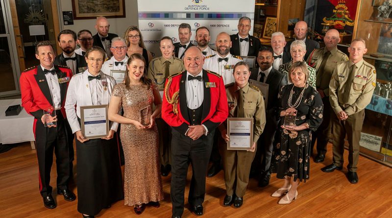 Major General Douglas Laidlaw poses with winners of Defence’s annual National Employer Support Awards at a formal dinner held at Gallipoli Barracks, Enoggera. Photo by Private Michael Currie.