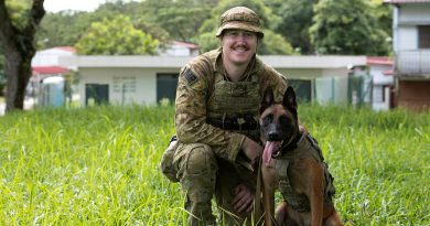 Military Police Dog Handler Private Aidan Fleming with his working dog Drago after taking part in urban warfare training in Singapore. Story by Lieutenant Amy Johnson. Photo by Leading Seaman Nadav Harel.