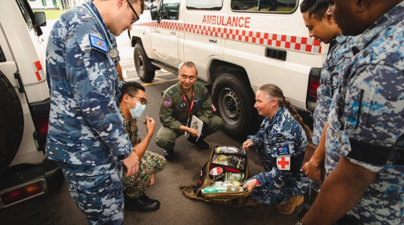 Flight Lieutenant Troy Gersbach, left, and Leading Aircraftwoman Amy Wardley alongside Malaysian Army and Air Force medical personnel during Exercise Elangaroo 22 in Malaysia. Story by Flight Lieutenant Bronwyn Marchant. Photo by Leading Aircraftman Adam Abela.