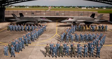 Personnel from 75 Squadron in front of two F-35As at RMAF Base Butterworth, Malaysia. Story by Flight Lieutenant Bronwyn Marchant. Photo by Leading Aircraftman Adam Abela.