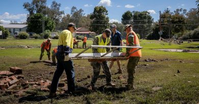 ADF personnel assist council workers to restore the memorial located in Eugowra, NSW, during Operation Flood Assist 22-2. Story by Captain Joanne Leca. Photo by Corporal Madhur Chitnis.