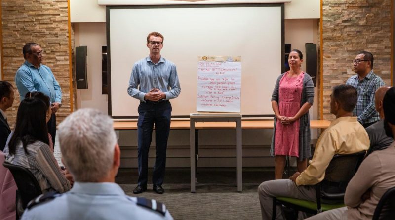 Corporal Carlos Linares Fernandez, left, Flying Officer Marco Kall, Leading Aircraftwoman Sonia Gomez Lopez and Sergeant Yuhang Ding participate in a workshop held at Brindabella Park, Canberra. Story by Squadron Leader Jessica Aldred. Photo by Leading Aircraftman Adam Abela.