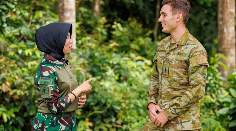 Royal Australian Navy Sailor Able Seaman Jamie Van Pletzen chats with an Indonesian Army Medic during Exercise Wirra Jaya at the Baturaja Training Area, South Sumatra, Indonesia. Story and photo by Corporal Dustin Anderson.
