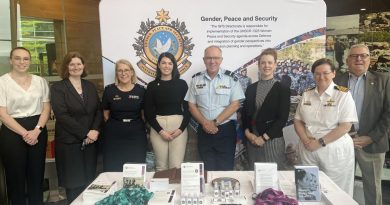 Air Commodore Grant Pinder with members of the Gender, Peace and Security Directorate and Joint Support Services Division at an information stand in Canberra. Story by Sam Cuninghame. Photo by Emily Egan.