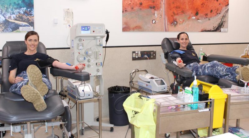 464 Squadron public affairs officers, Flight Lieutenants Kate Davis, left, and Steffi Blavius donate blood at a Red Cross Lifeblood Donation Centre in Melbourne as part of the Defence Blood Challenge. Photo supplied.