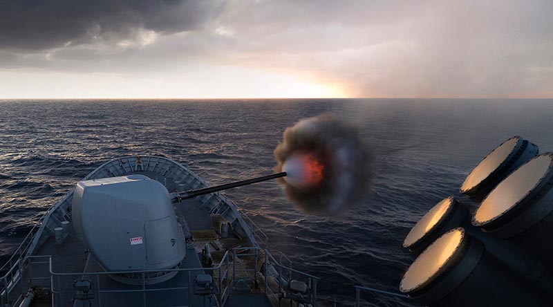 HMAS Arunta fires her 5-inch naval gun during Exercise Malabar 2022. Photo by Leading Seaman Susan Mossop.