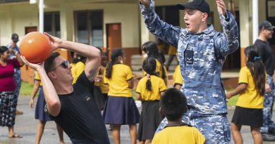 RAAF Flight Lieutenant Jayden Hasemann, left, and Leading Aircraftman Jack Atkins play basketball with students at Sokehs Roie Soledi Peidie Elementary School. Story by Flight Lieutenant Dee Irwin. Photo by Leading Aircraftman Sam Price.