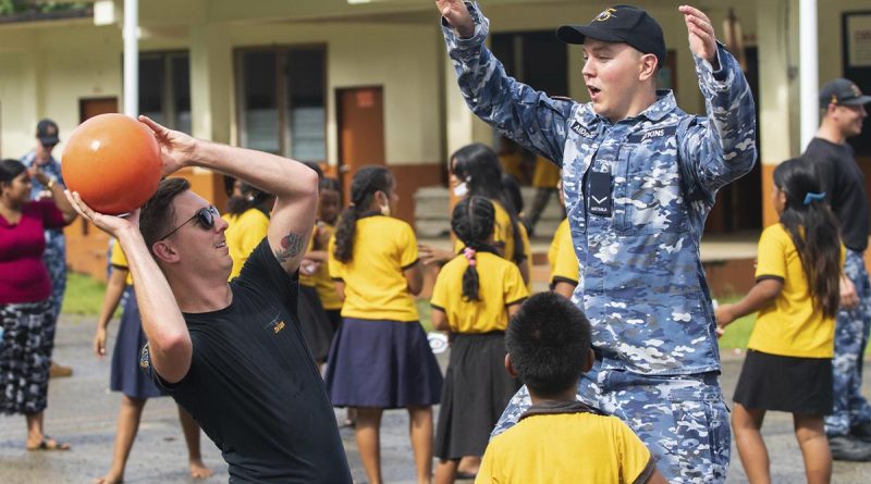 RAAF Flight Lieutenant Jayden Hasemann, left, and Leading Aircraftman Jack Atkins play basketball with students at Sokehs Roie Soledi Peidie Elementary School. Story by Flight Lieutenant Dee Irwin. Photo by Leading Aircraftman Sam Price.