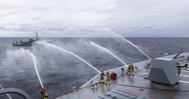 HMAS Hobart's ship's company render firefighting assistance to Japan Maritime Self-Defense Force minesweeping tender JS Bungo during a damage control exercise. Story and photo by Leading Seaman Daniel Goodman.