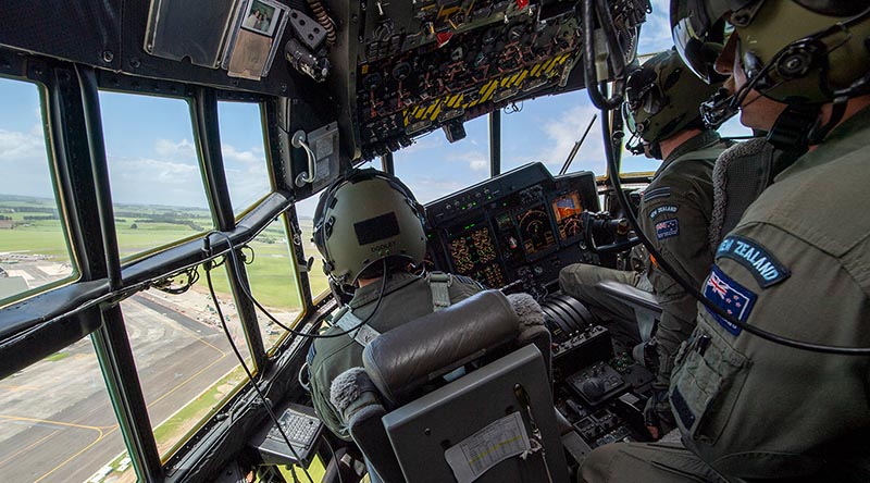 A Royal New Zealand Air Force C-130H flys over RNZAF Base Ohakea during Tactical Exercise 22. RNZAF photo.
