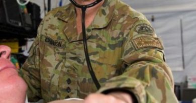 Major Dianne Hutchinson checks a patient's breathing rate during training at the Camp Taji Clinic at the Taji Military Complex, Iraq, in 2017. Story by Flight Lieutenant Nick O’Connor. Photo by Able Seaman Chris Beerens.