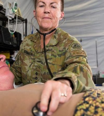 Major Dianne Hutchinson checks a patient's breathing rate during training at the Camp Taji Clinic at the Taji Military Complex, Iraq, in 2017. Story by Flight Lieutenant Nick O’Connor. Photo by Able Seaman Chris Beerens.