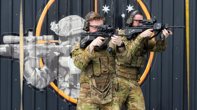 From left, Private Shane Bagley and Private Frank Atkinson of the 1st Battalion, Royal Australian Regiment on HMAS Adelaide. Story by Lieutenant Amy Johnson and Lieutenant Emma Anderson. Photo by Leading Seaman Sittichai Sakonpoonpol.