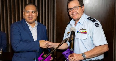 ADF Deputy Chief Joint Operations Command Air Vice-Marshal Mike Kitcher, right, presents a gift to the Office of Civil Defence Deputy Administrator for Operations, Assistant Secretary Bernardo Rafaelito Alejandro IV. Story by Captain Zoe Griffyn. Photo by Brandon Grey.