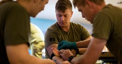 Private Samuel Sutcliffe, centre, from 1st Battalion, Royal Australian Regiment, volunteers as a patient during combat first-aid training. Story by Lieutenant Amy Johnson. Photos by Leading Seaman Sittichai Sakonpoonpol.