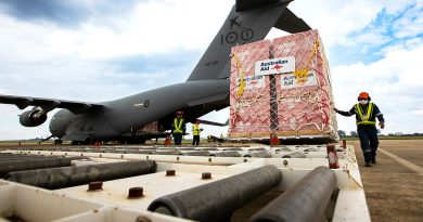 Australian Aid pallets are unloaded from a RAAF C-17A Globemaster at Wattay International Airport in Laos. Story by Flying Officer Lily Lancaster. Photos by Sergeant David Said.