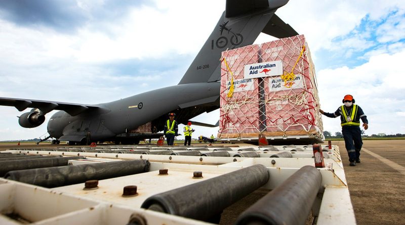 Australian Aid pallets are unloaded from a RAAF C-17A Globemaster at Wattay International Airport in Laos. Story by Flying Officer Lily Lancaster. Photos by Sergeant David Said.