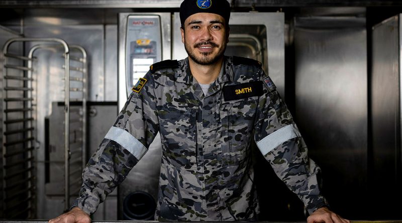 Seaman Maritime Logistics Chef William Smith in the galley on board HMAS Adelaide. Story by Staff Sergeant (USMC) Antonio De la Fuente and Lieutenant Amy Johnson. Photo by Leading Seaman Nadav Harel.