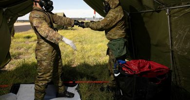 Combat Support Group aviators assisting role players during a decontamination scenario during Exercise Toxic Gauntlet. Story by Flying Officer Greg Hinks. Photo by Corporal Brett Sherriff.