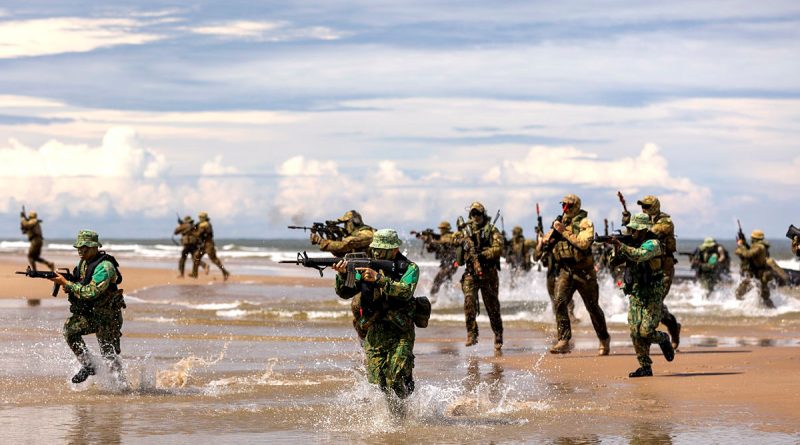 Soldiers from the ADF and Royal Brunei Armed Forces come to shore during a joint military exercise. Story by Flying Officer Brent Moloney. Photo by Leading Seaman Jarryd Capper.
