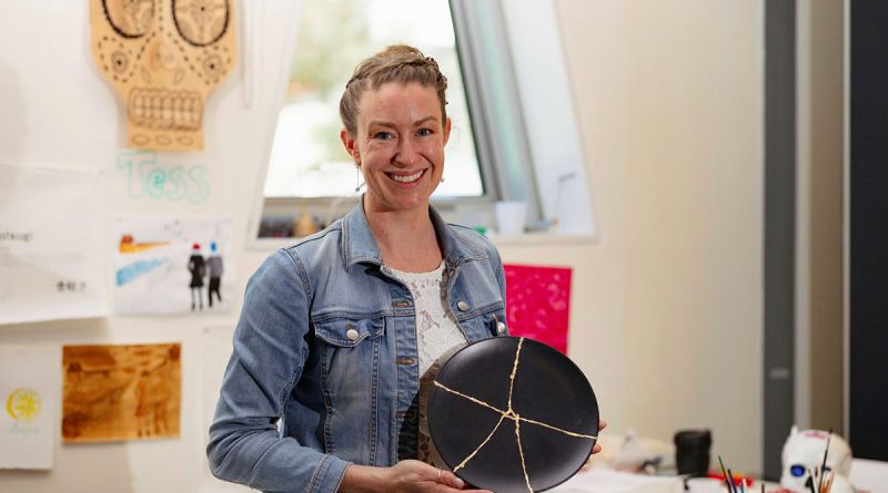 ADF ARRTS Program participant FLTLT Tess O'Brien with her art in the visual arts studio at the University of Canberra's Inspire Centre. Story by Flight Lieutenant Thomas McCoy. Photo by CPL Olivia Cameron.